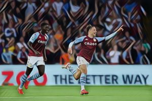 Matty Cash celebrates after scoring against Everton