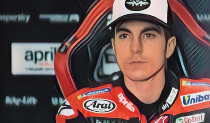 Vinales sitting in his Aprilia garage