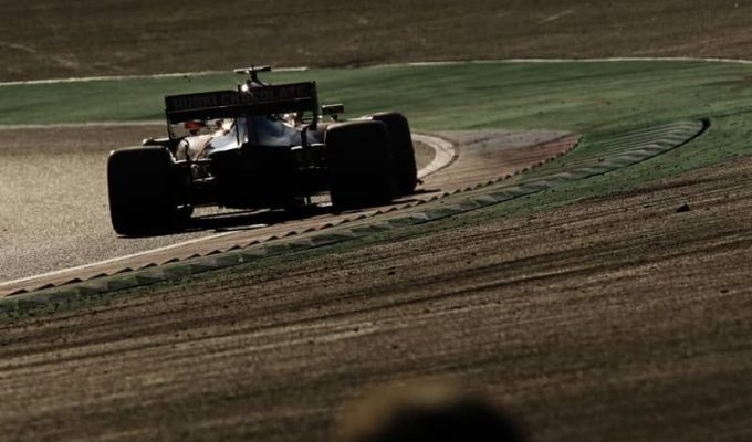 A McLaren driving around Suzuka in 2019